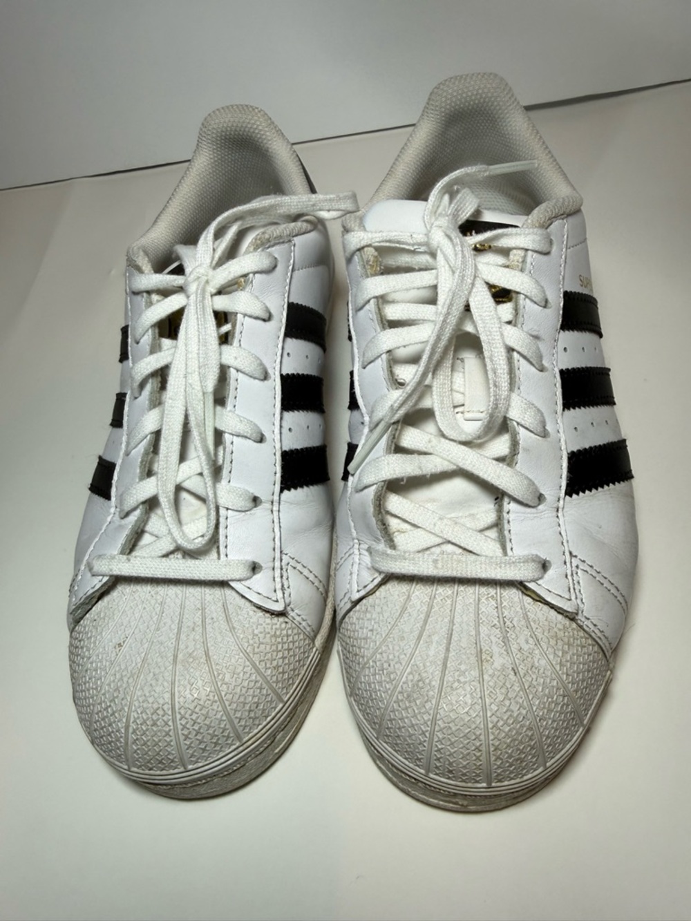 adidas Women’s White Sneakers with Black Stripes